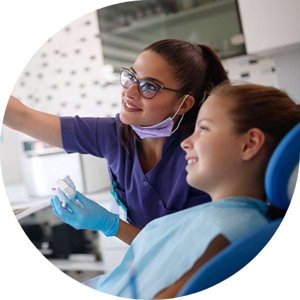 dentist showing patient x-ray