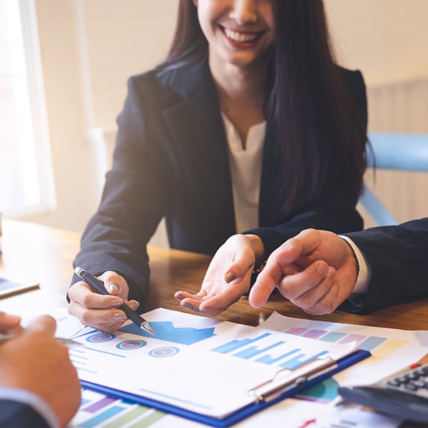 Fee Based Financial Planner walking through spreadsheets